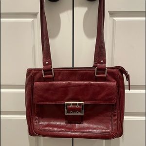 Wilsons Leather purse burgundy several pockets long shoulder straps buckle side